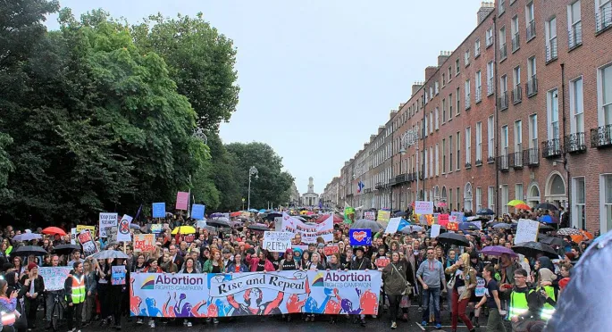 Photograph of large crowd of people holding banners at the 2016 March for Choice in Dublin