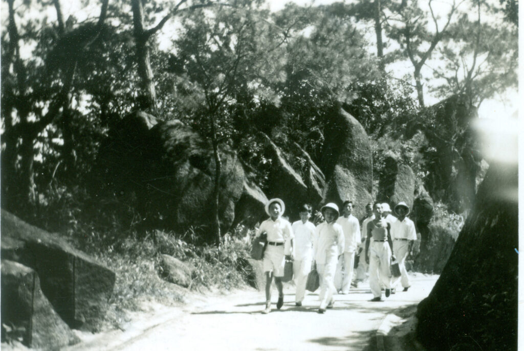 Black and white photo of Wah Yan College boys out for a days hike