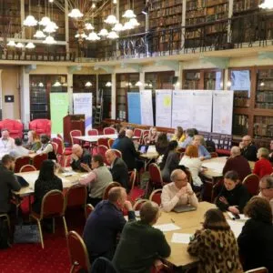 Attendees of the NORF Workshop sitting at tables in the Meeting Room of the Royal Irish Academy, discussing the topics of the day.